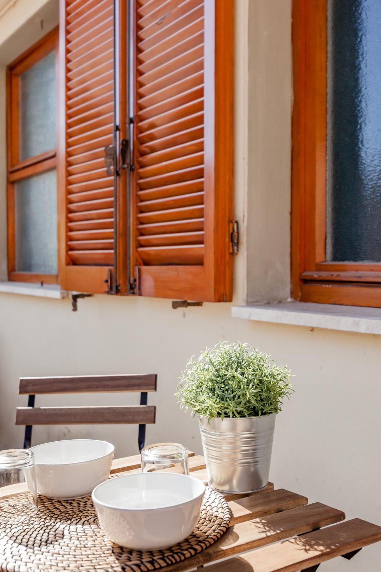 Open The Classic Wooden Shutters At A Cozy Nest Florença